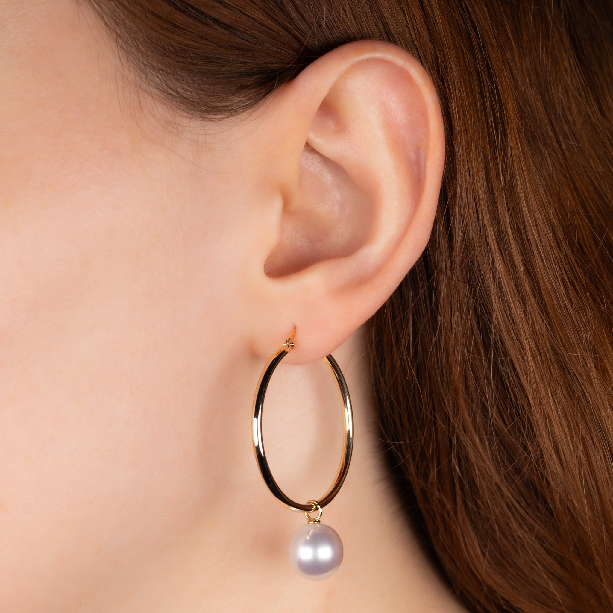 9K Yellow Gold Australian South Sea 10-11 mm Cultured Pearl Hoop Earrings on a model