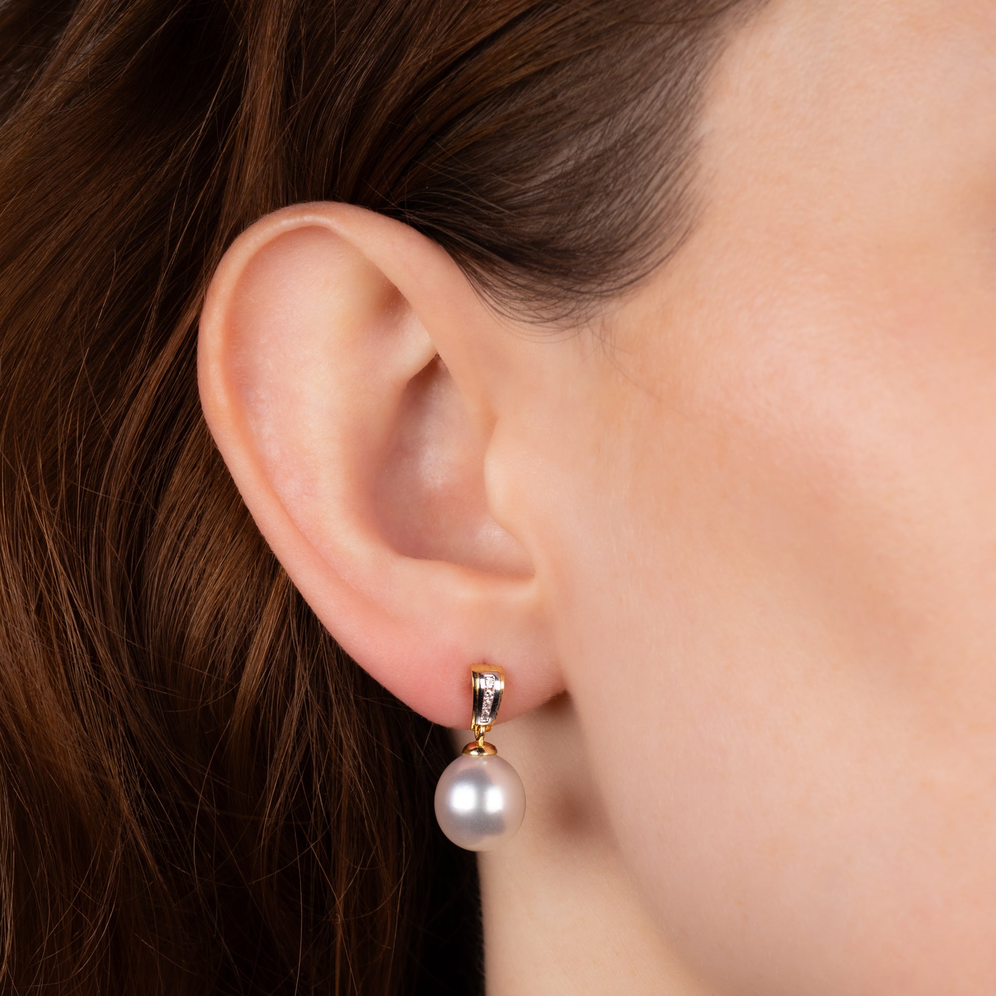 18K Yellow Gold Australian South Sea 10-11mm Cultured Pearl and Diamond Drop Earrings on a model