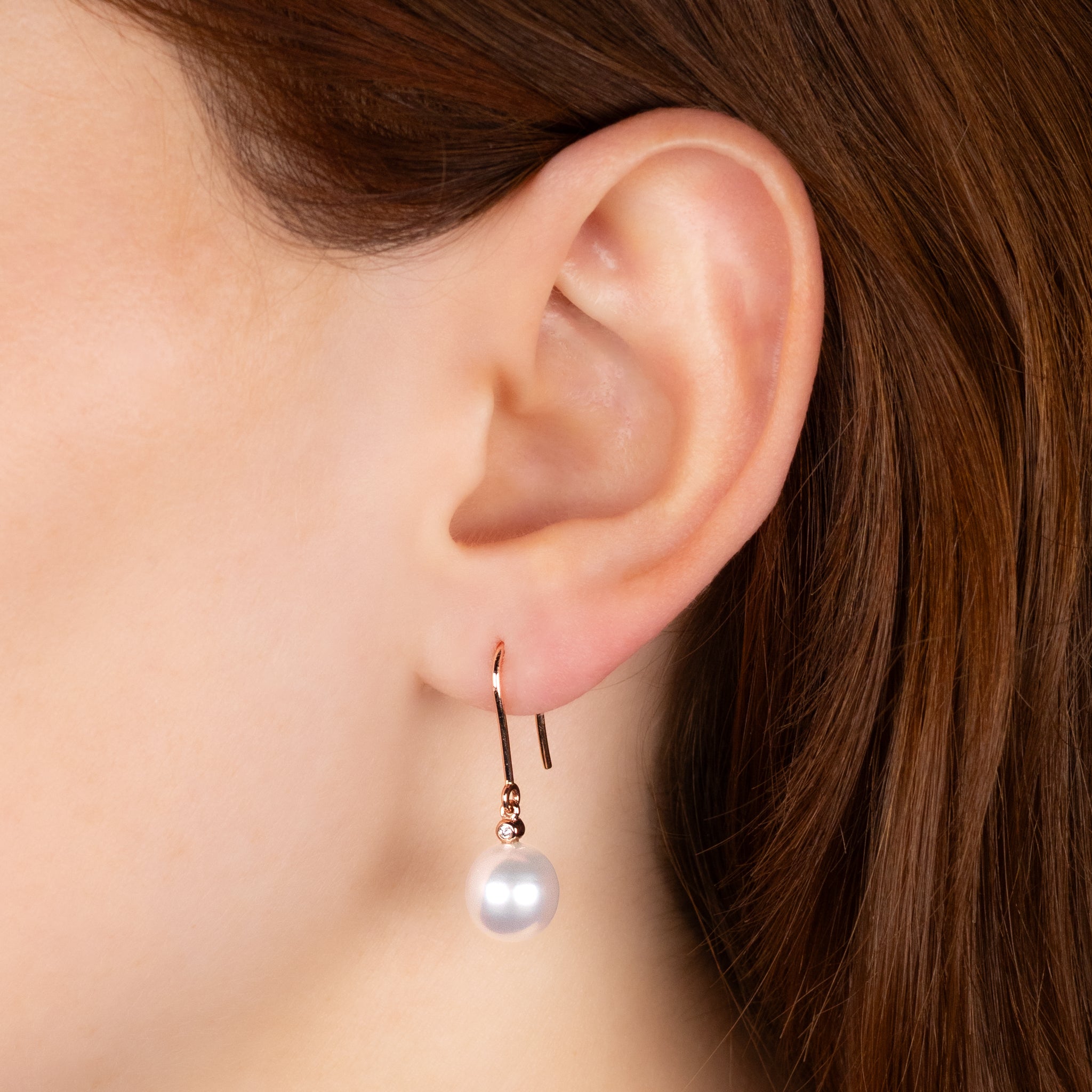 9K Rose Gold Australian South Sea 9-10 mm Cultured Pearl and Diamond Hook Earrings worn on a model