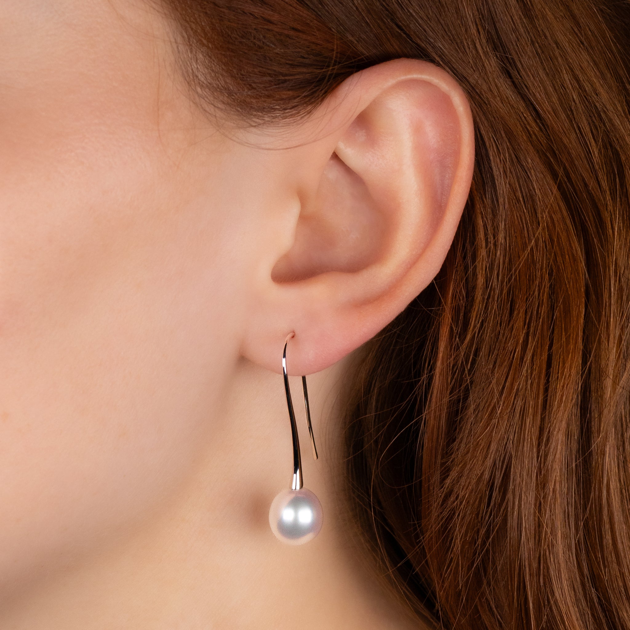 9K White Gold Australian South Sea 10-11 mm Cultured Pearl Hook Earrings worn on a model