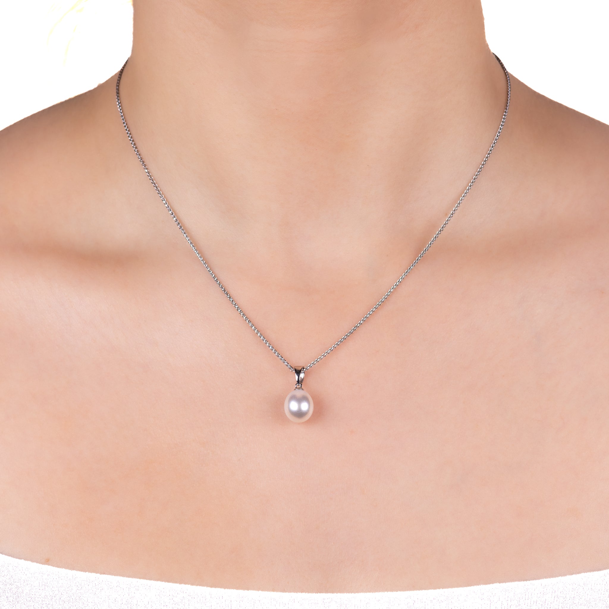 Pearl necklace on a mannequin with a white background