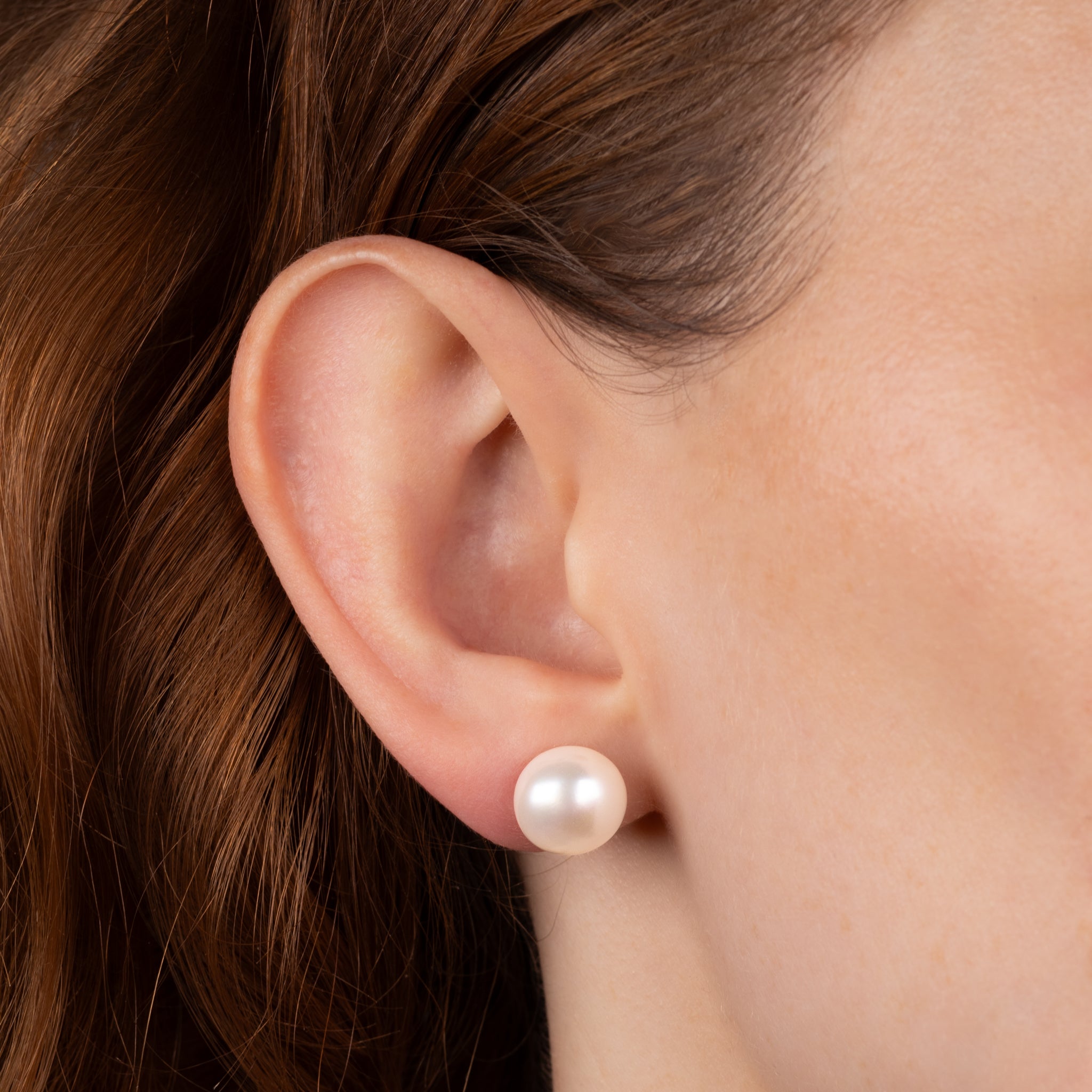 9K Yellow Gold Freshwater 11-12 mm Pearl Stud Earrings worn on a model