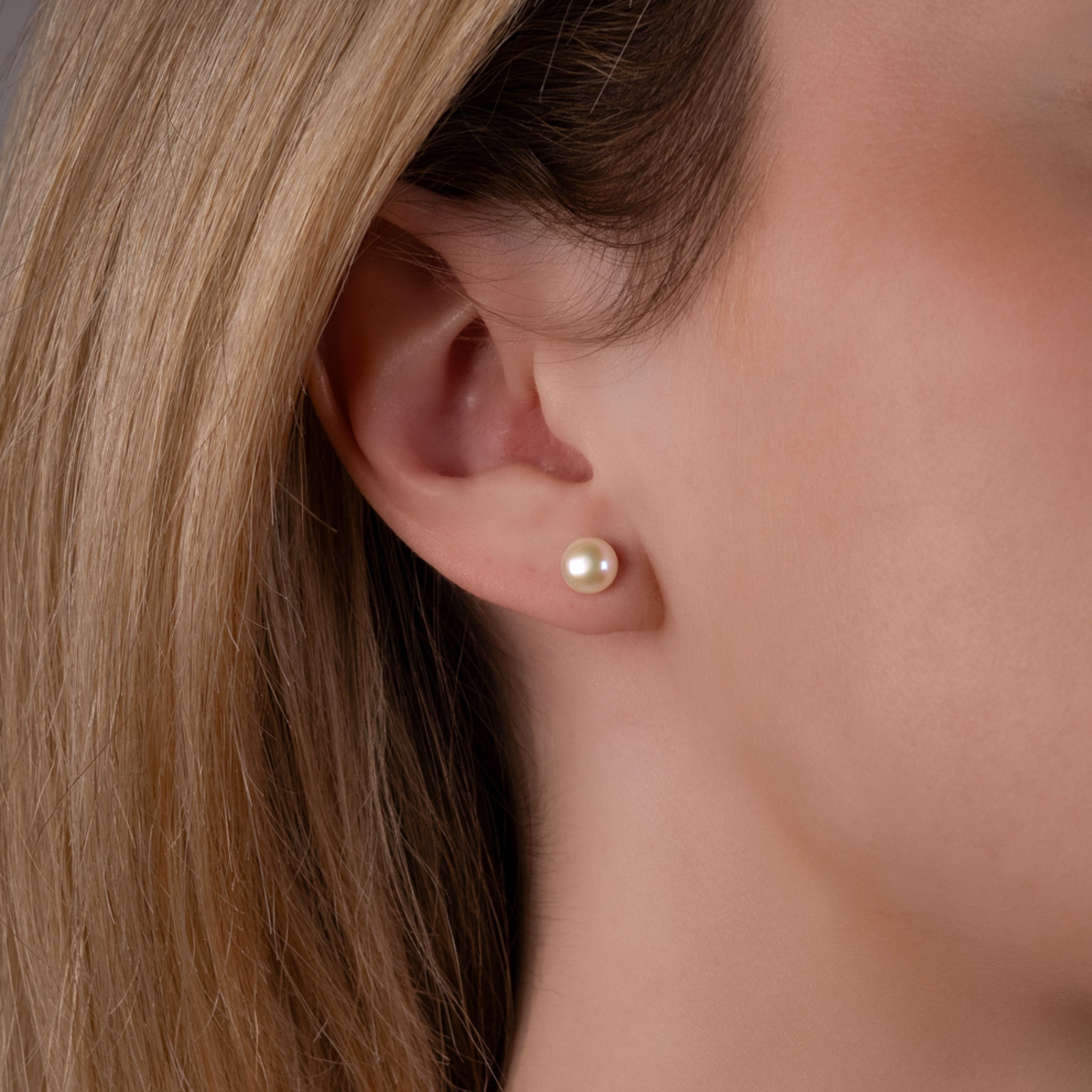 Sterling Silver Freshwater Pearl 6-7mm Stud Earrings on a model