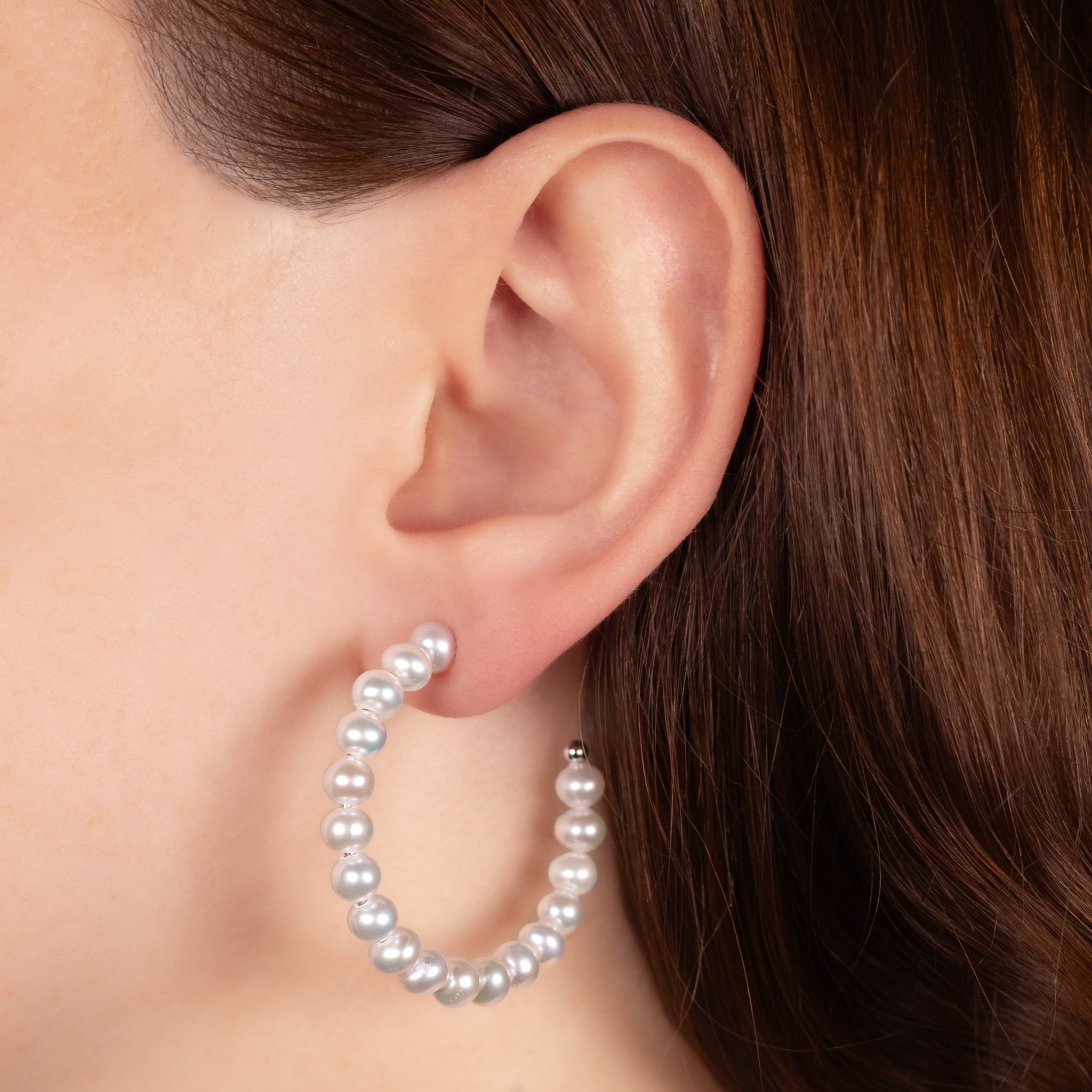 Sterling Silver Freshwater Pearl 5-5.5 mm Hoop Earrings on a model
