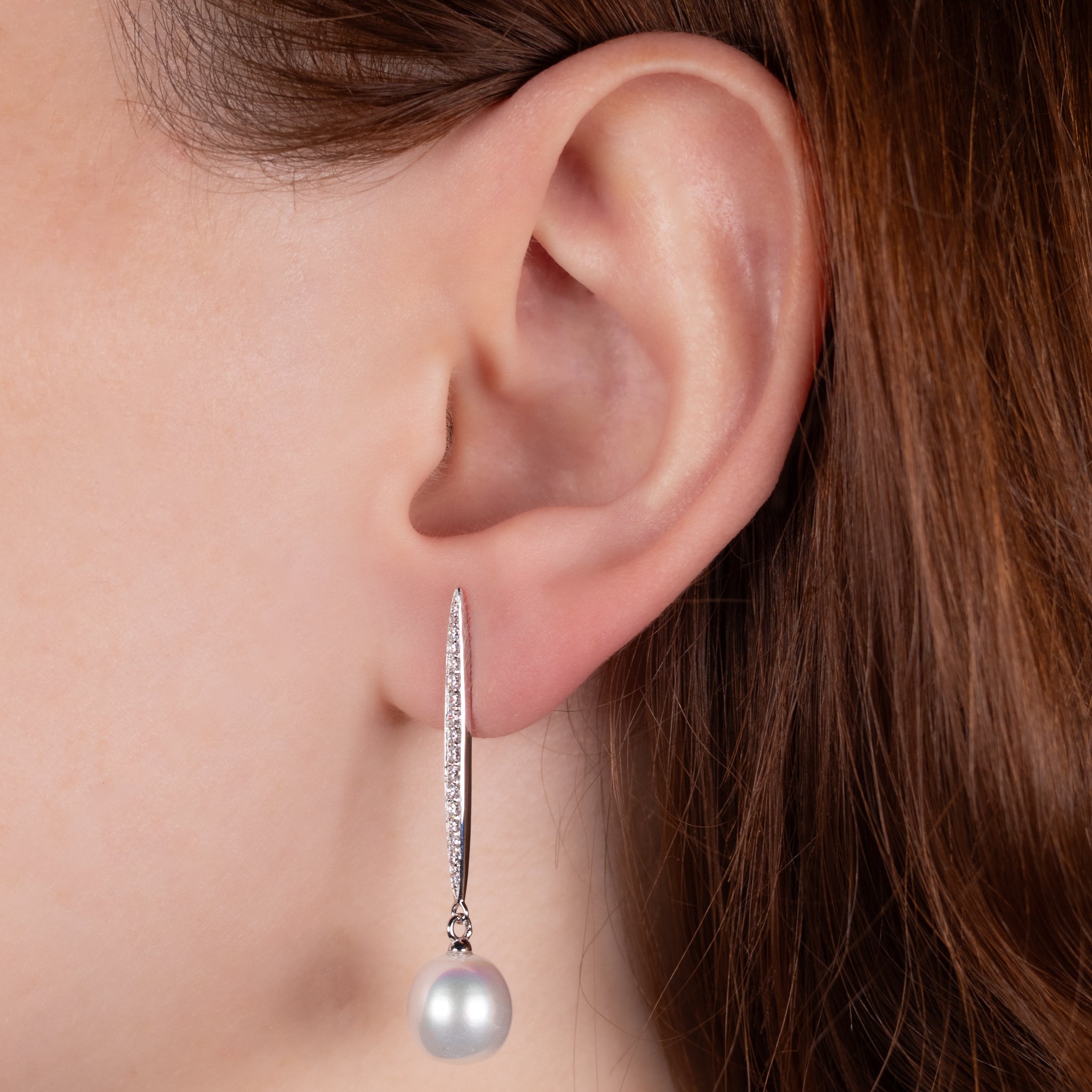 Sterling Silver Freshwater Pearl and Cubic Zirconia Drop Earrings on a model