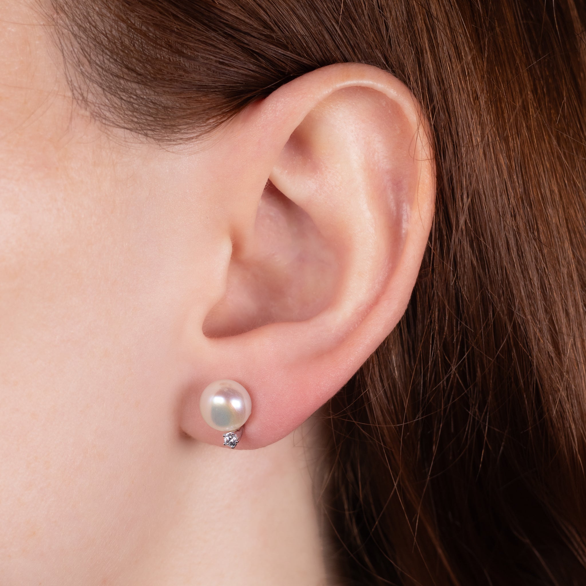 Sterling Silver Freshwater 8-8.5 mm Pearl Stud Earrings on a model