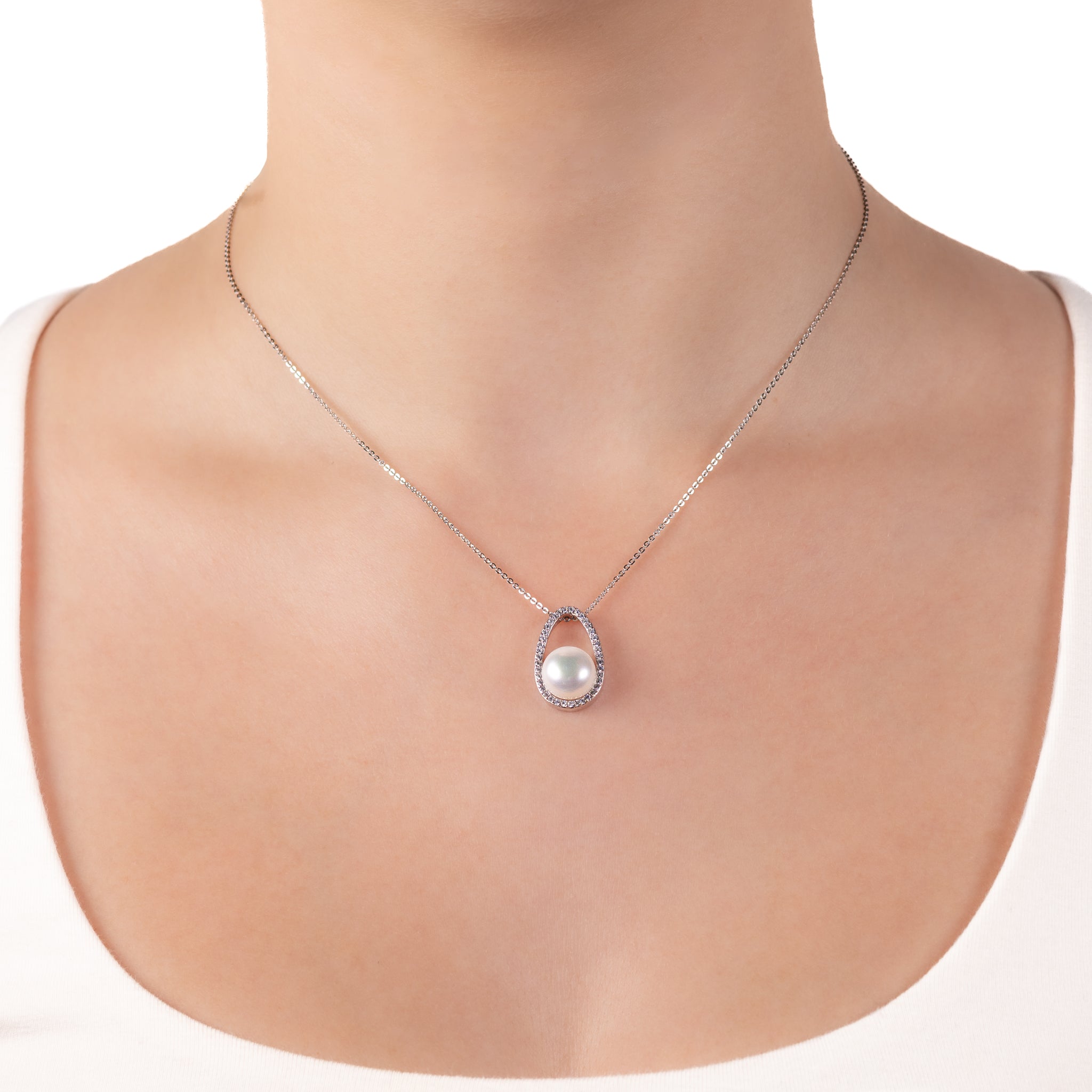 Sterling Silver Freshwater Pearl White 10mm Cubic Zirconia Pendant worn around a models neck with a white background