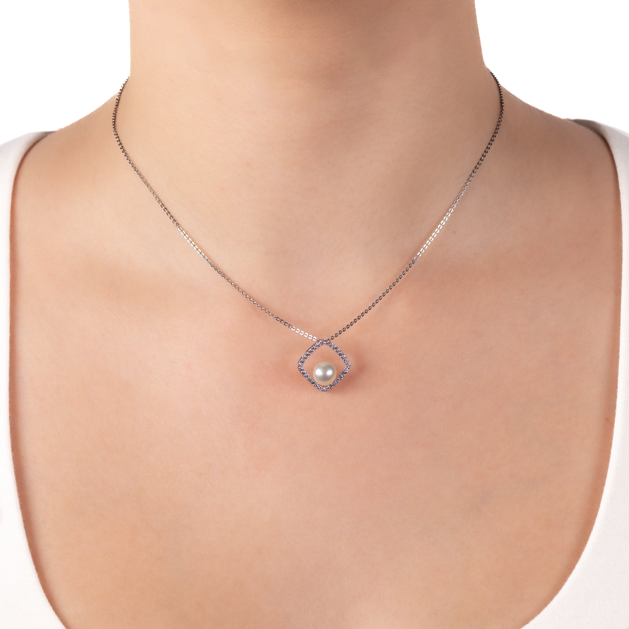 Sterling Silver 7-7.5mm Freshwater Pearl and Cubic Zirconia Pendant worn on a model around her neck