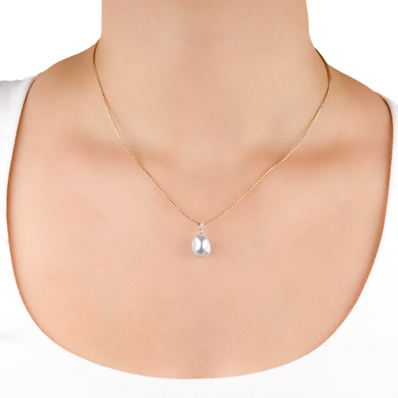 18K Yellow Gold Australian South Sea 1.3g Keshi Pearl and Diamond Pendant on a model