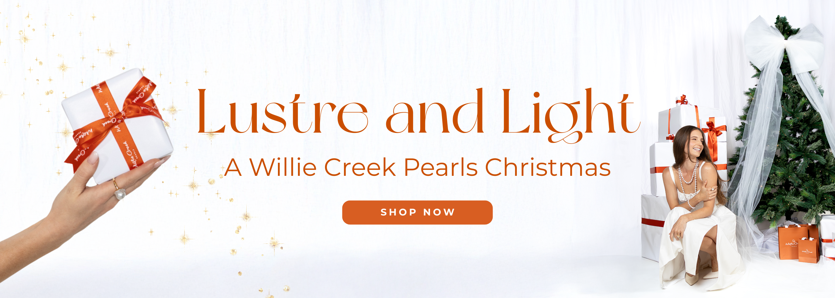 Promotional banner for 'Lustre and Light: A Willie Creek Pearls Christmas' with a hand holding a gift and a woman by a Christmas tree.