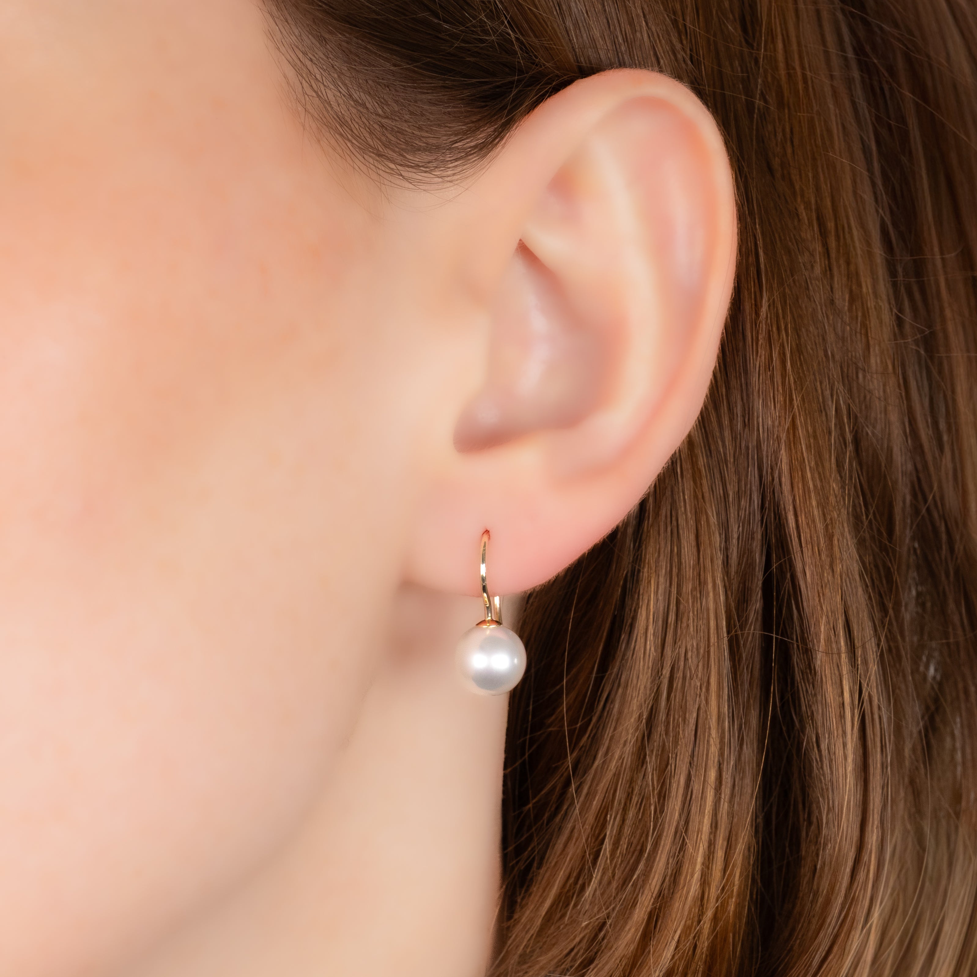 9K Yellow Gold Australian South Sea 8-9 mm Cultured Pearl Hook Earrings on a model