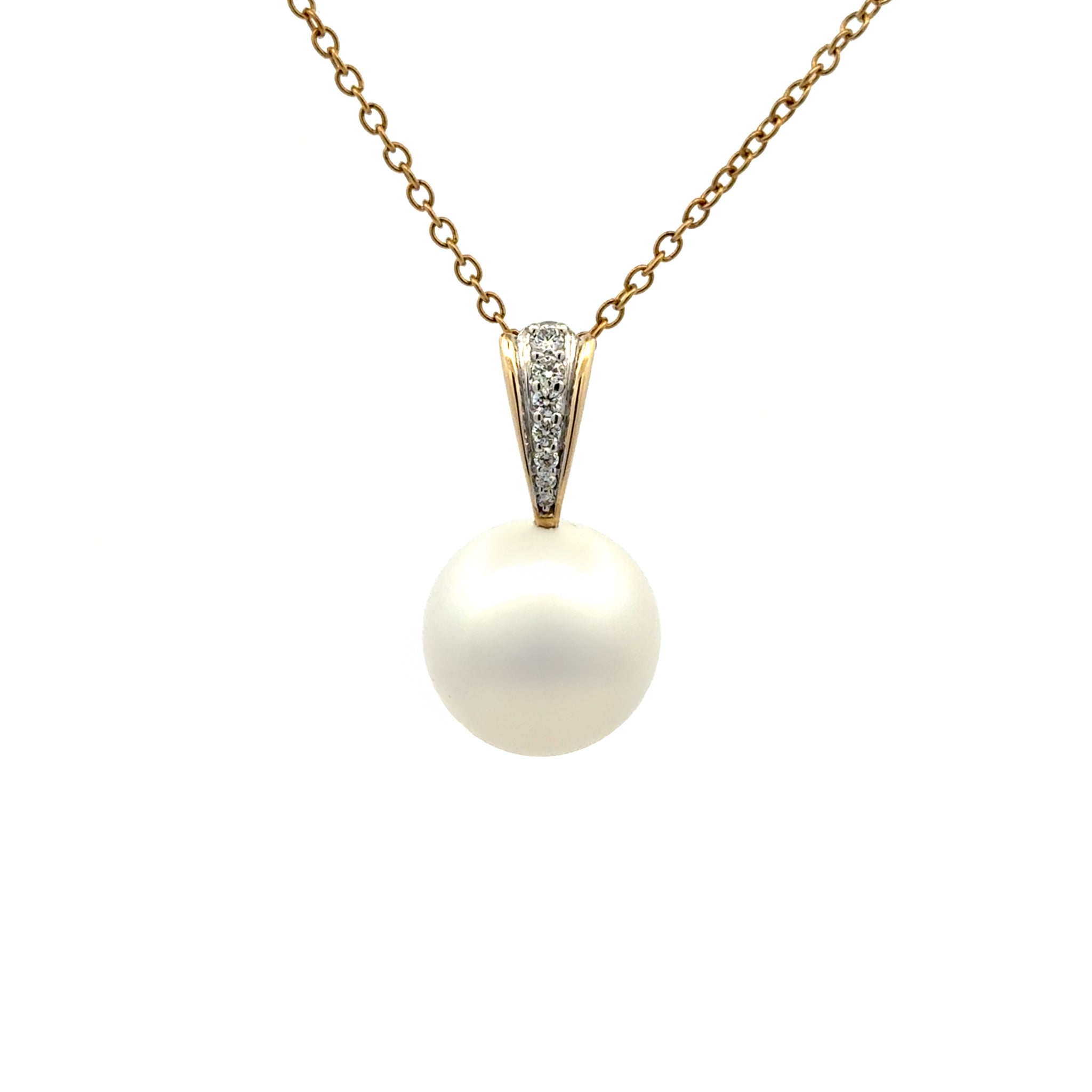 Pearl pendant with gold chain on a white background