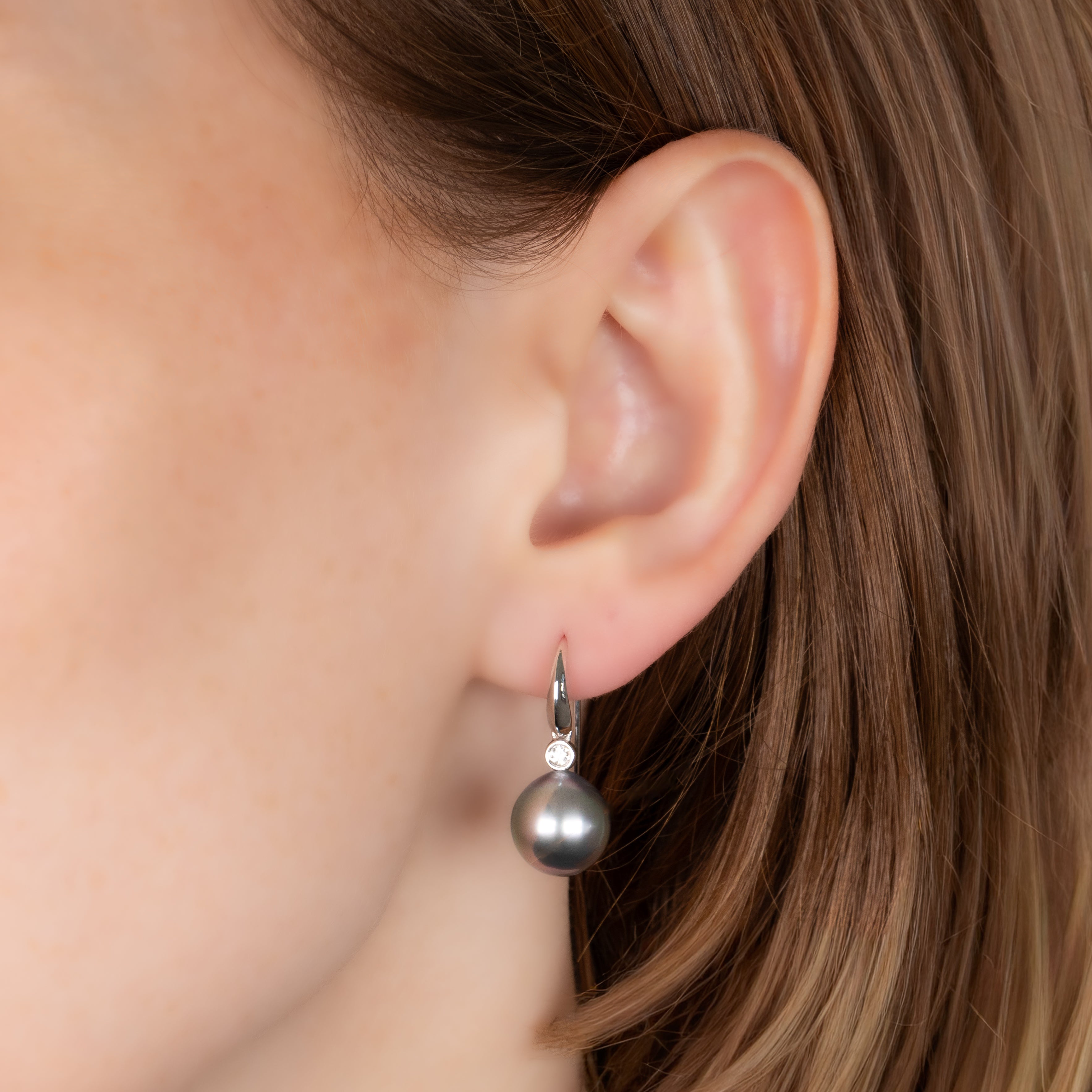 18K White Gold Tahitian 10-11 mm Cultured Pearl and Diamond Hook Earrings on a model