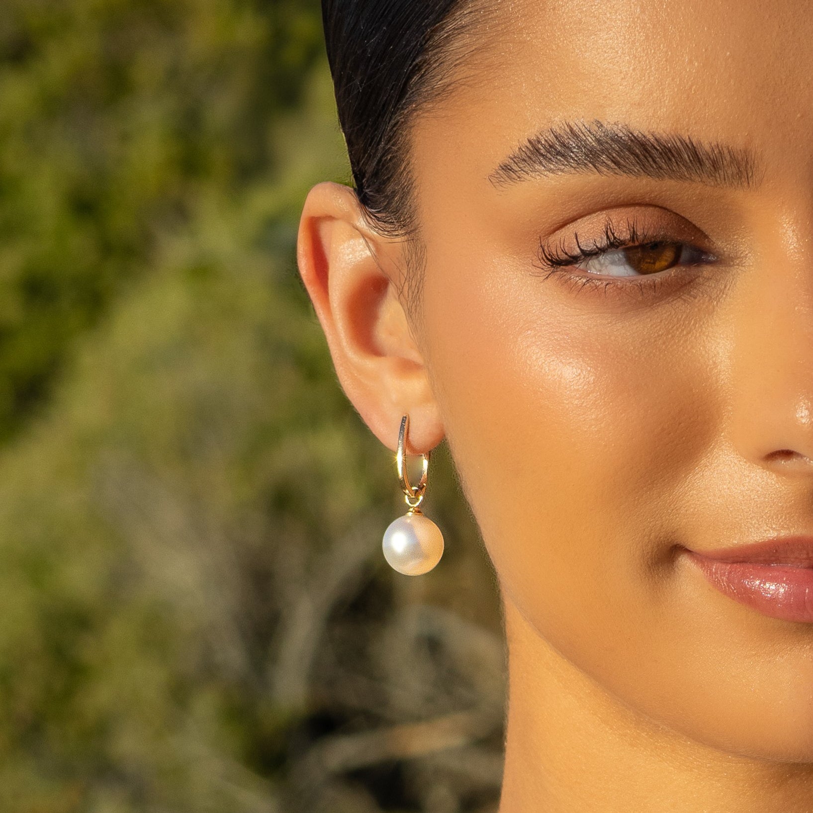 9K Yellow Gold Australian South Sea Cultured 12-13 mm Pearl Huggie Earrings on a model