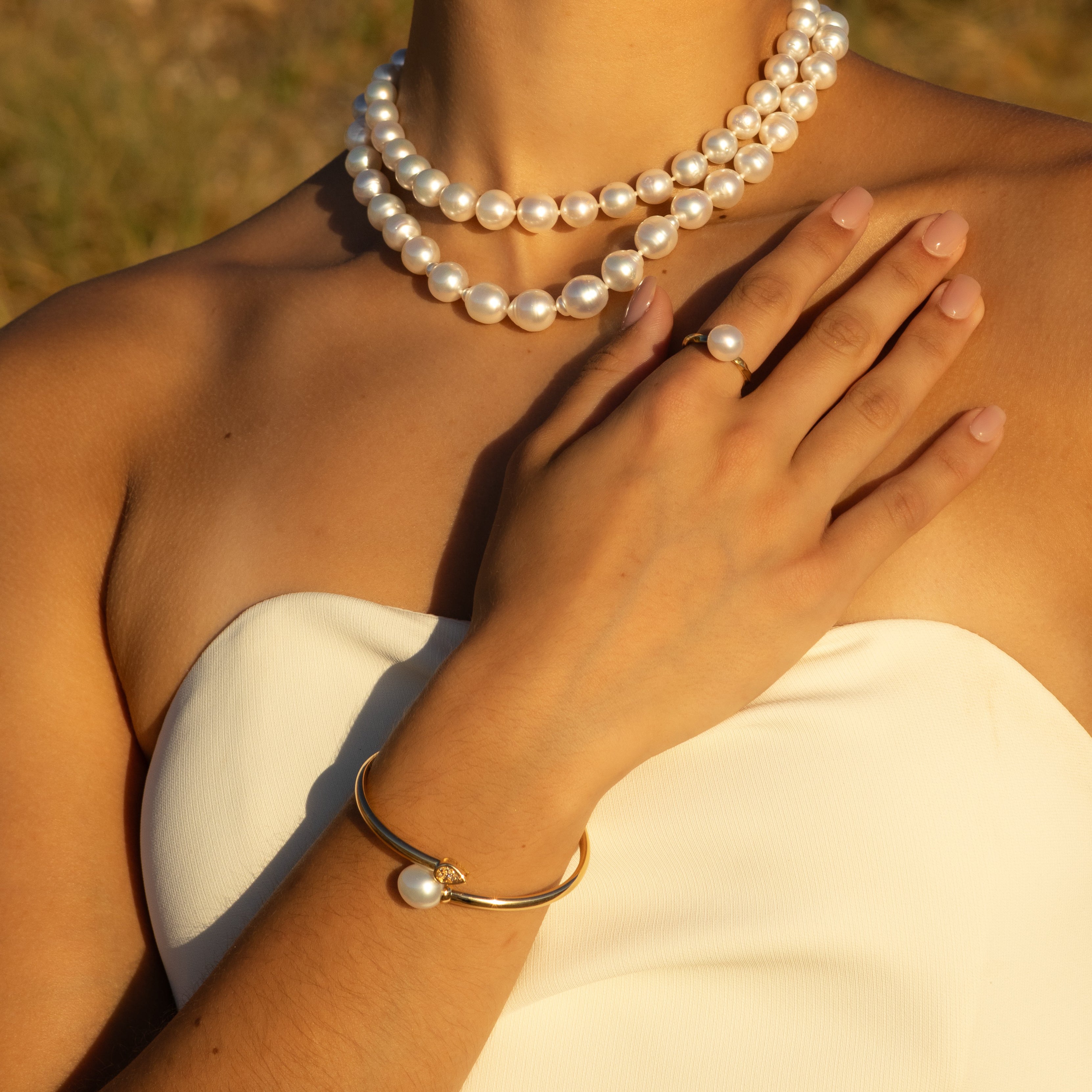 18K Yellow Gold Australian South Sea 11-12 mm Cultured Pearl and Argyle Diamond Bangle on a model