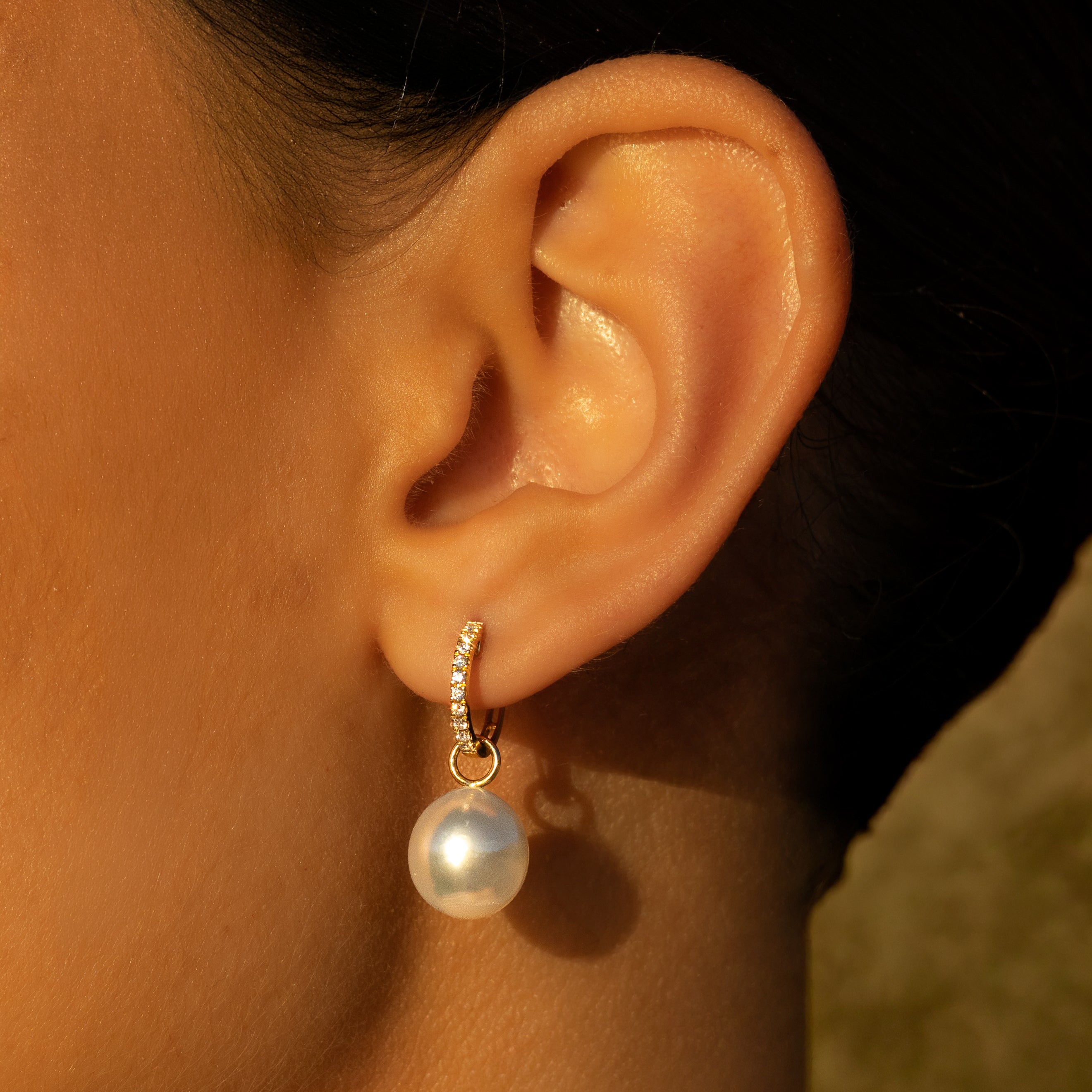 18K Yellow Gold Australian South Sea 9-10 mm Cultured Pearl and Diamond Huggie Earrings on a model