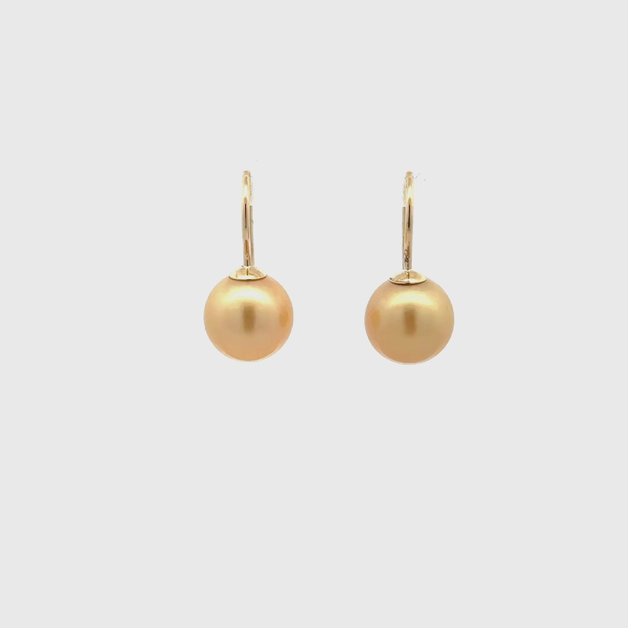 9K Yellow Gold South Sea 10-11mm Cultured Pearl Hook Earrings 360 degree view on a white background
