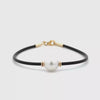 360 degree view of our black Neoprene Pearl Bracelet with 9k yellow gold clasp, with an Australian South Sea Peal cupped wither side by two yellow gold like beads on a white background