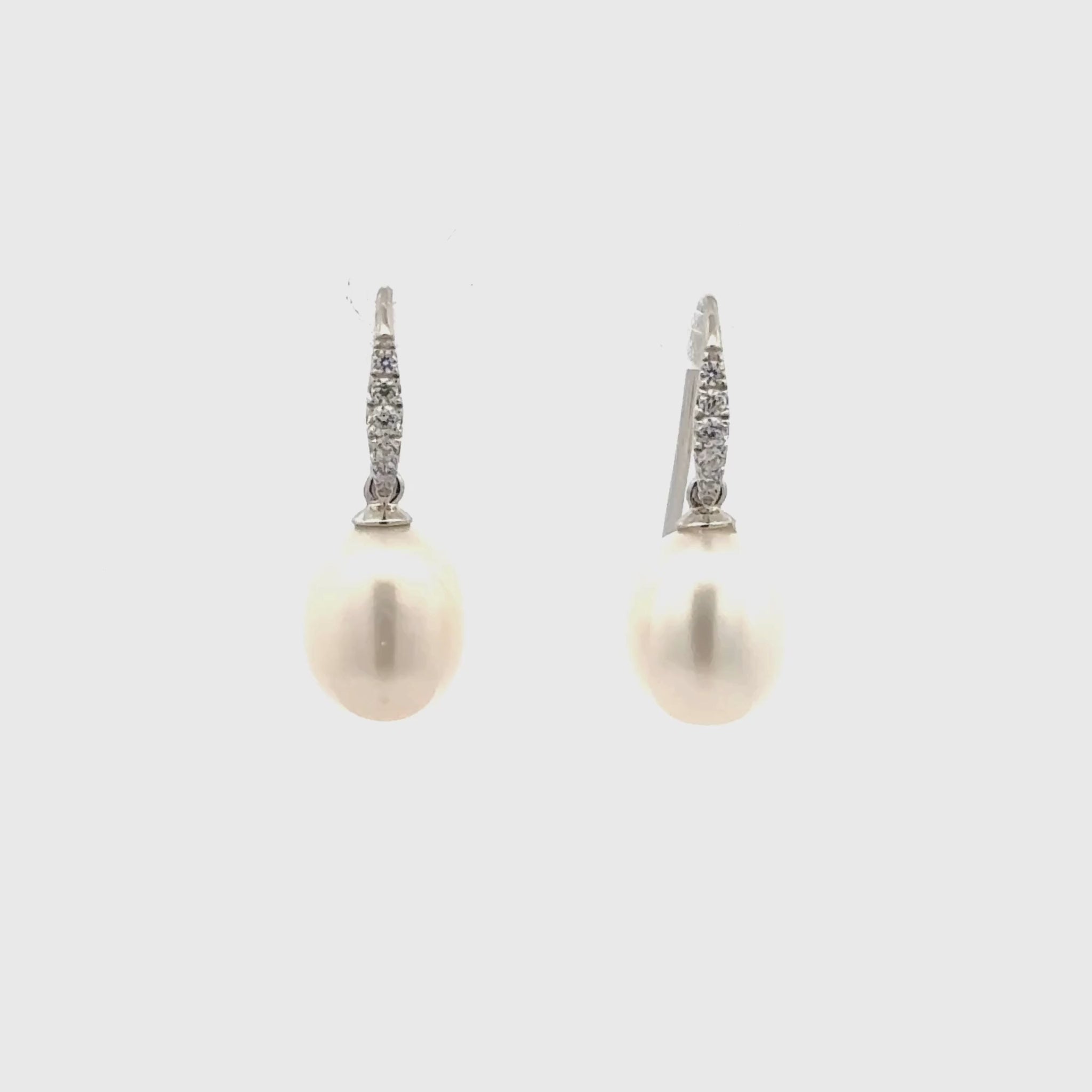 Sterling Silver Freshwater Pearl 8-9 mm White Drop & Cubic Zirconia Hook Earrings on a white background, 360 degree view