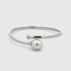 Silver bangle with a white pearl on a white background 360 degree view
